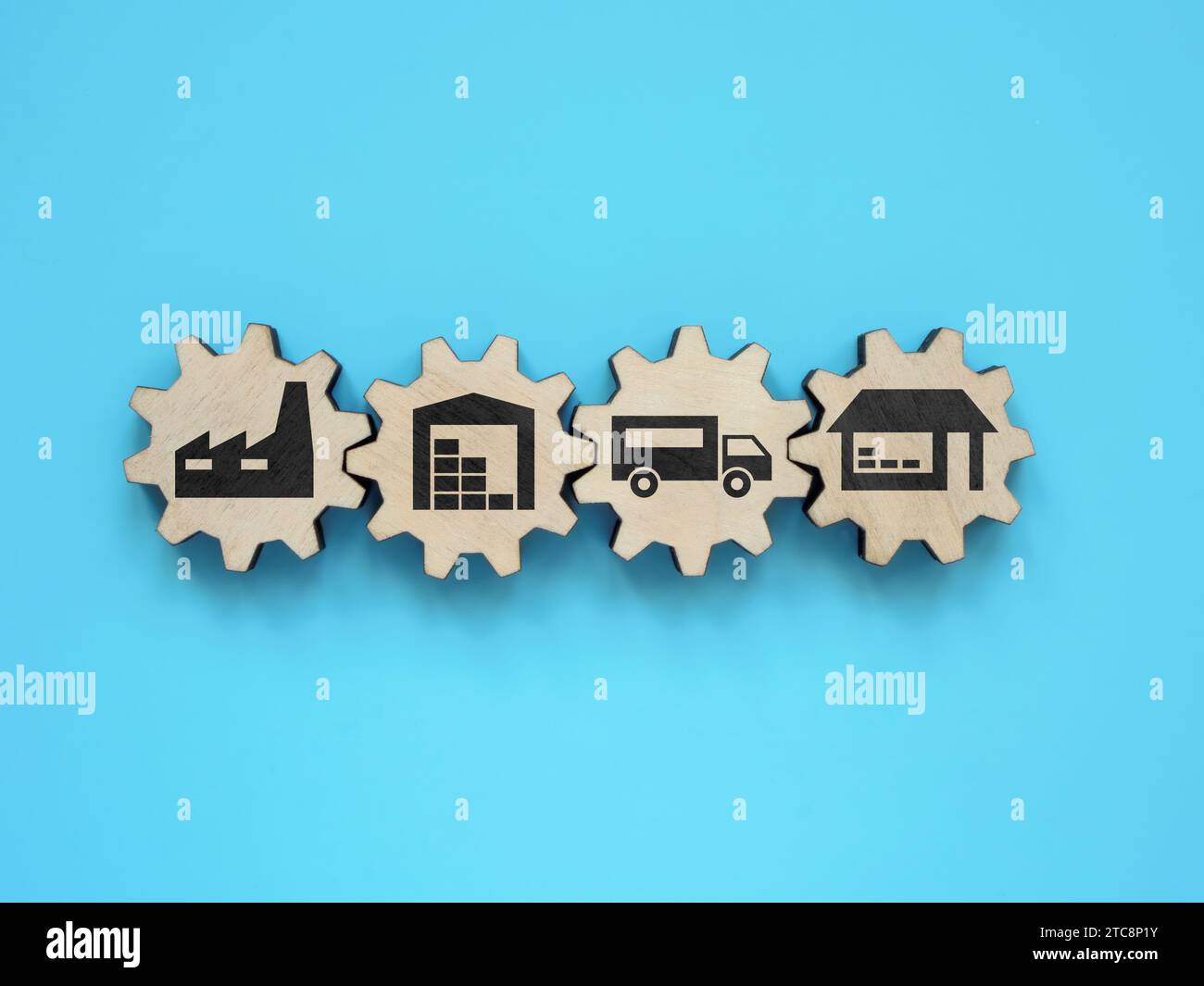 Supply chain management. Gear wheels with signs of factory, warehouse and transport. Stock Photo
