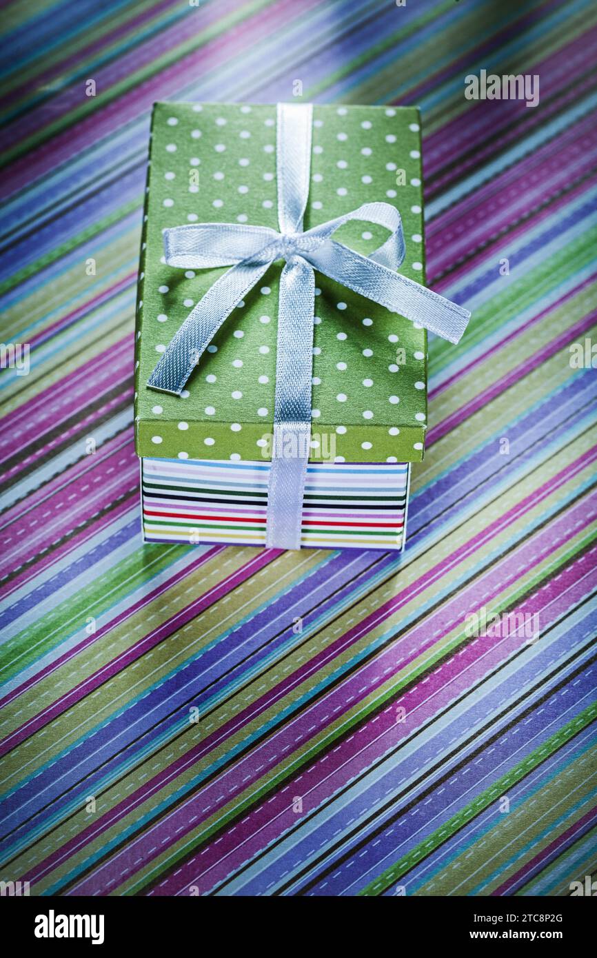 Decorated present box on striped tablecloth celebrations concept Stock Photo