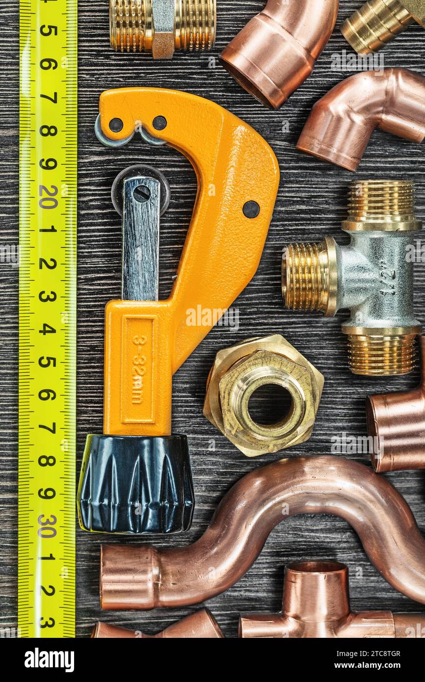 Brass water pipes Tape measure Pipe cutter Stock Photo Alamy