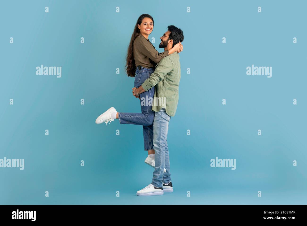 Loving indian guy lifting up his beautiful girlfriend Stock Photo