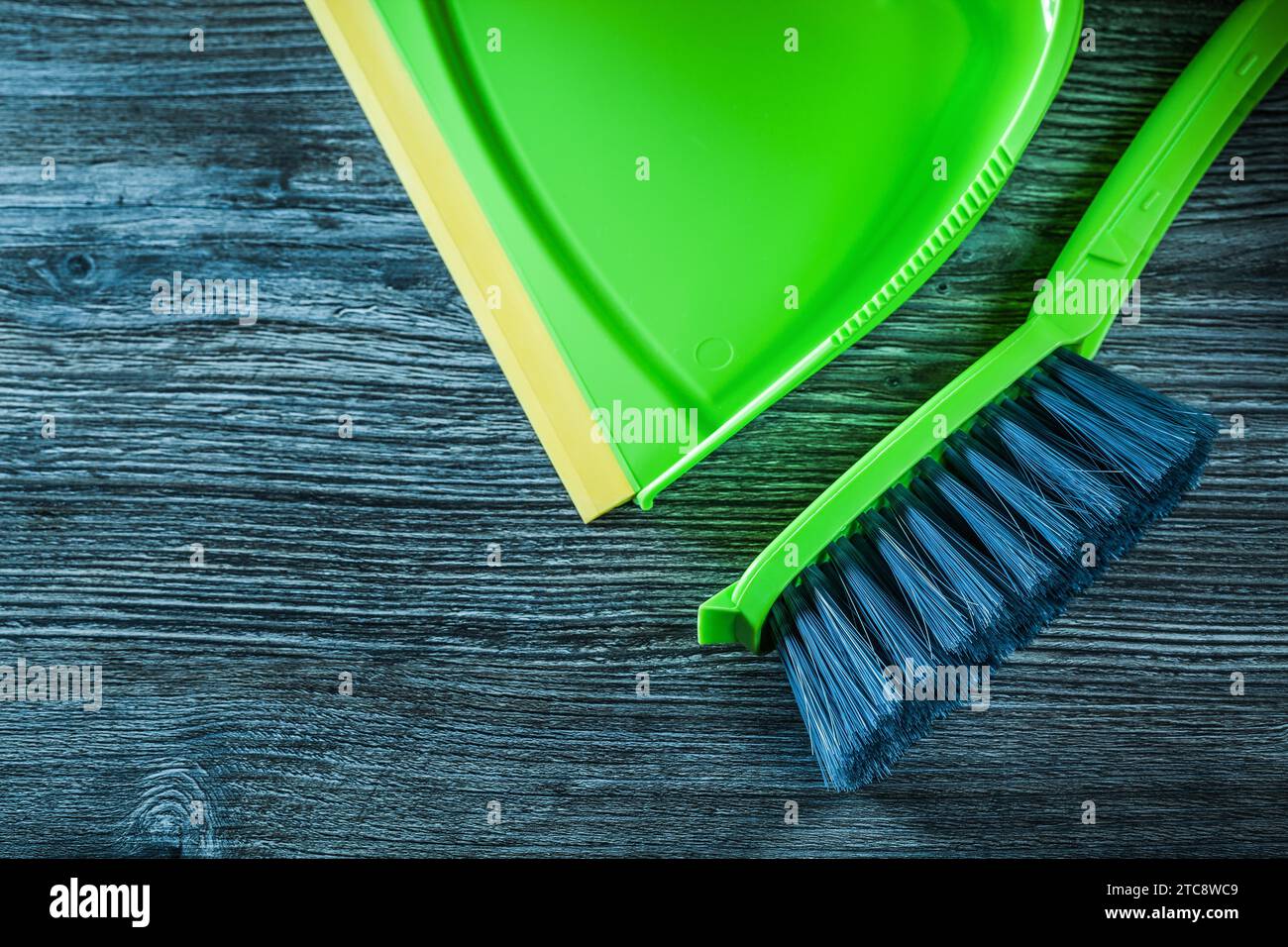 Dustpan and dustpan on an old wooden board Stock Photo Alamy
