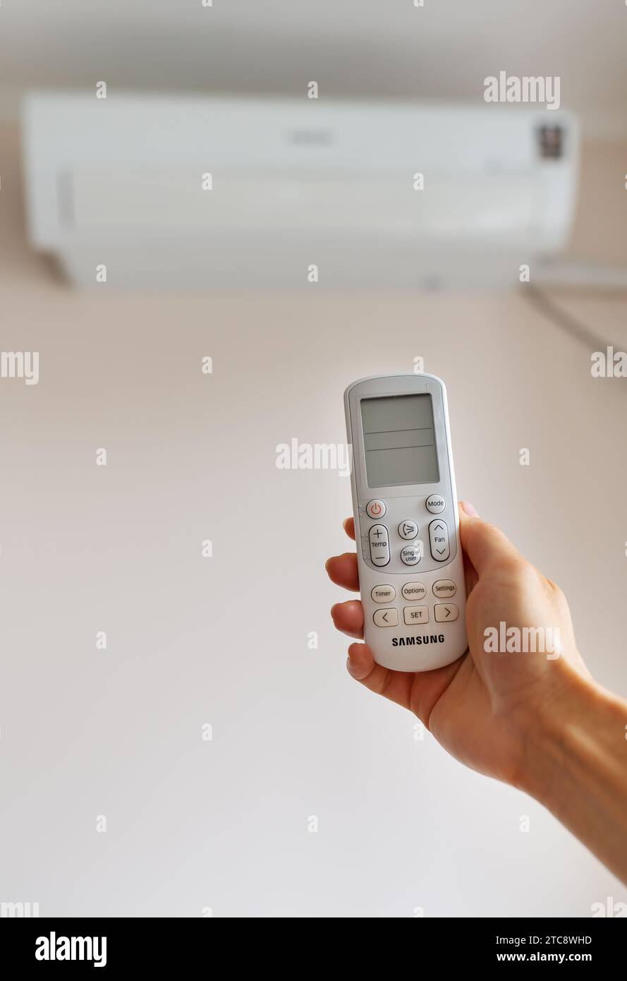 Remote control for controlling the air conditioner using the remote control Stock Photo