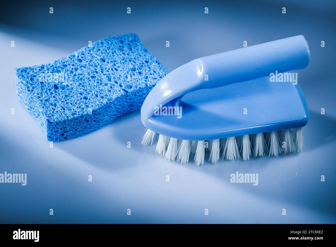 New plastic brush sponge on white background Stock Photo - Alamy