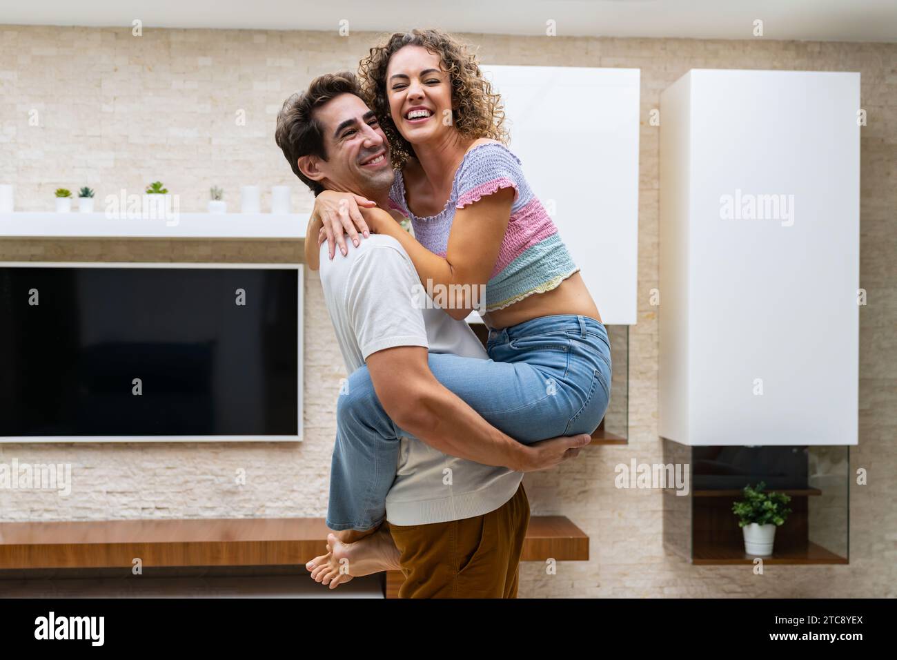 Amorous couple hugging hi-res stock photography and images - Alamy
