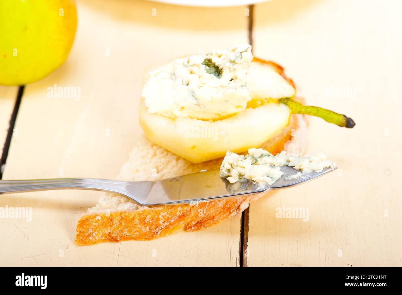 Selection of different cheese and fresh pears appetizer snack Stock Photo