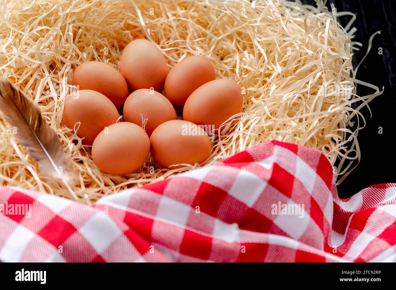 Brown chicken eggs lying in the nest. fresh chicken eggs Stock Photo