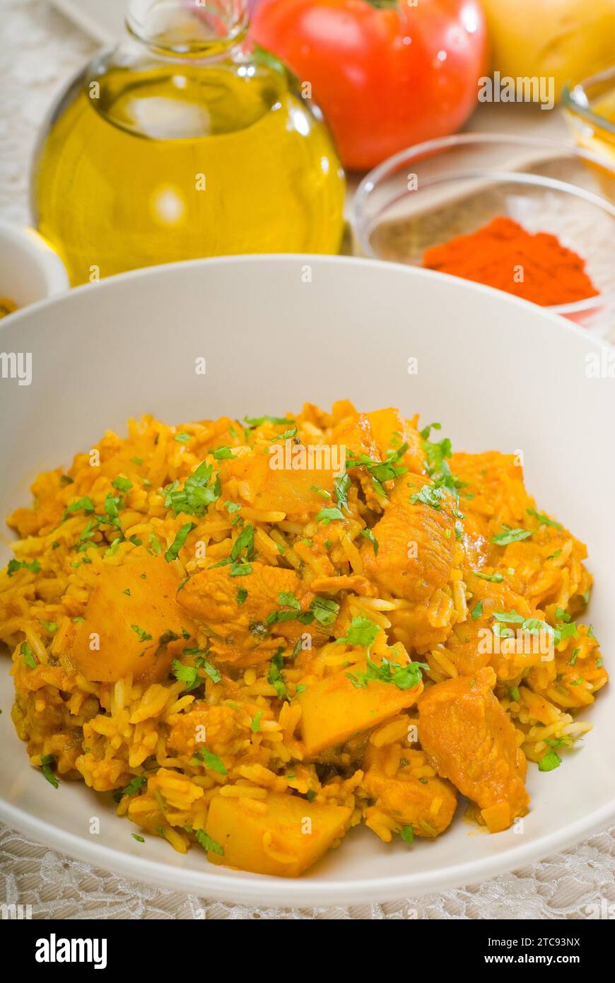 Fresh home made curry beef rice and potatoes with ingredients around