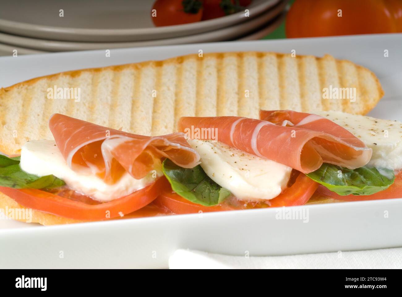 Panini sandwich with fresh caprese and parma ham Stock Photo