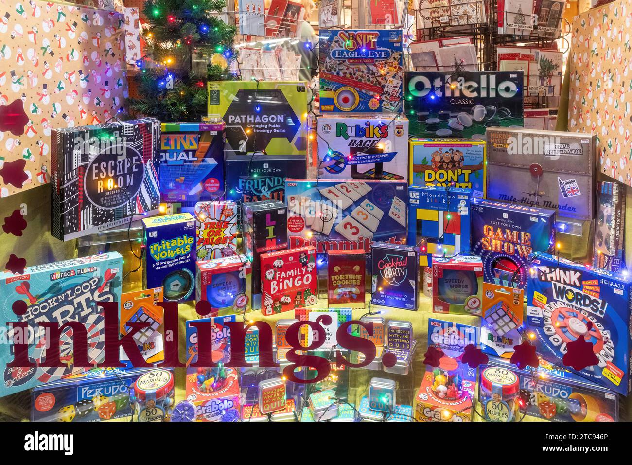Shop window display of different board games for Christmas at Inklings, an independent gift and card shop in Hungerford, West Berkshire, England, UK Stock Photo