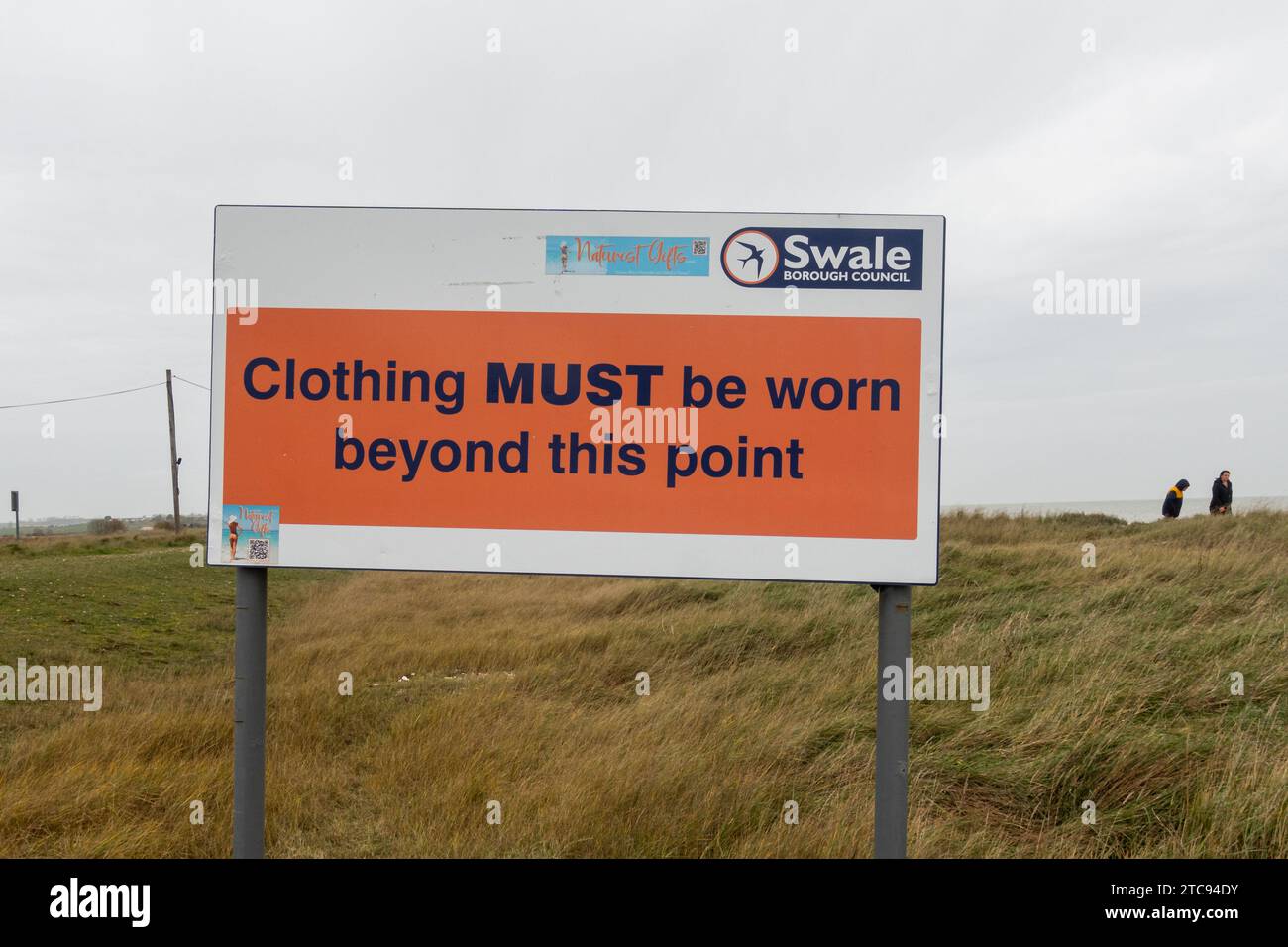 Sign on leaving Swale Naturist Beach on the Isle of Sheppey, Kent, England, UK, Clothing must be worn beyond this point Stock Photo