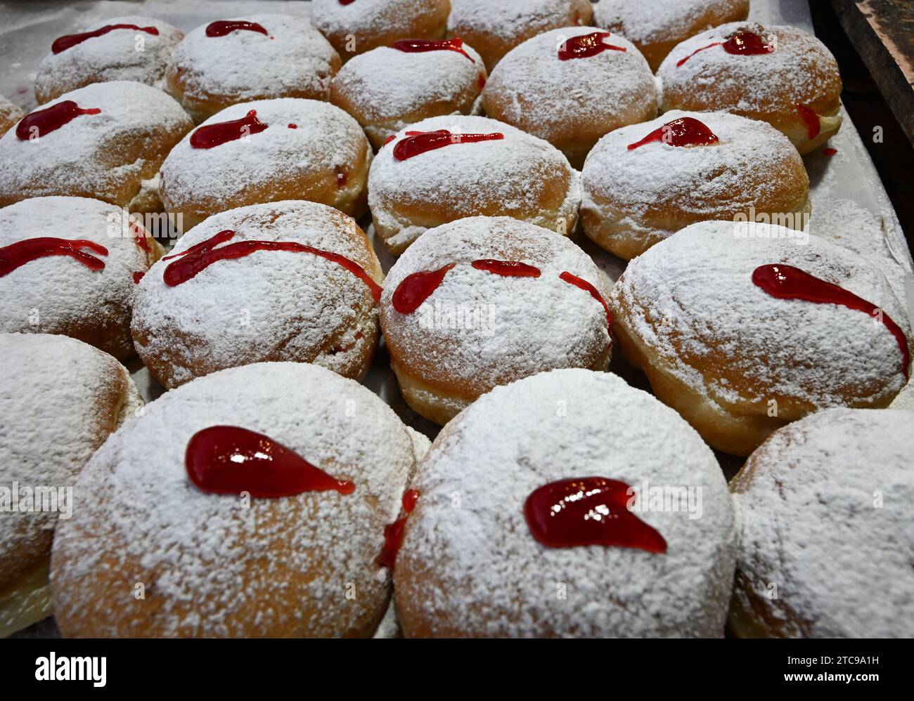 Jerusalem, Israel. 11th Dec, 2023. A view of sufganiyot, a deep fried jelly filled doughnut, on