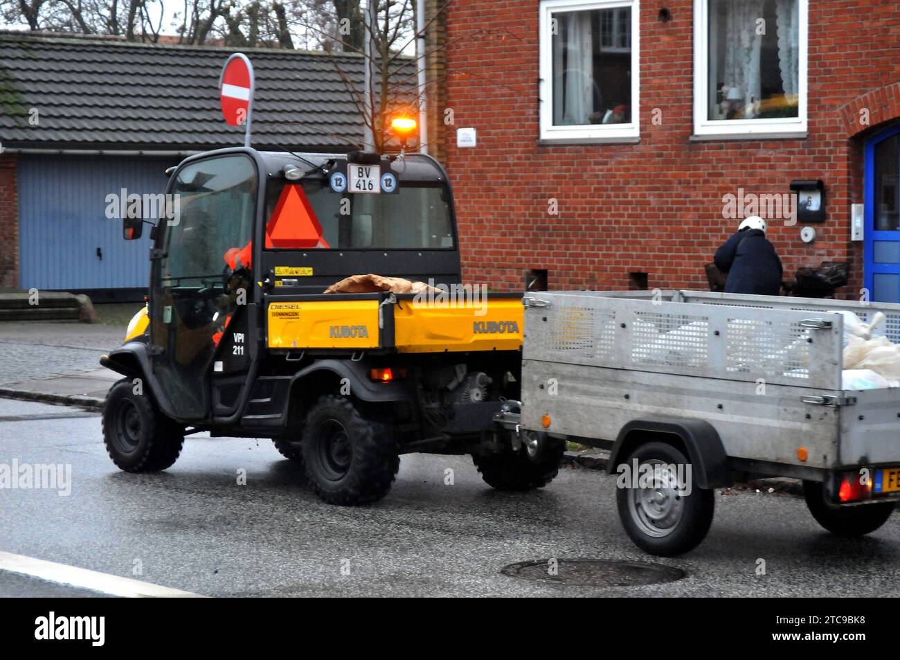 Copenhagen, Denmark /11 December 2023/.Male worker picking up left over