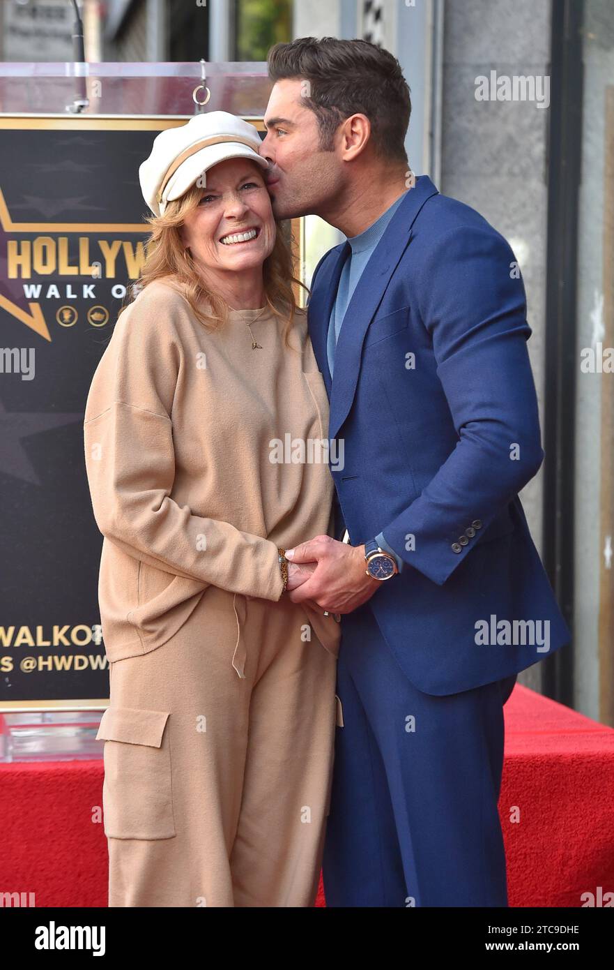 Starla Baskett, left, and Zac Efron attend a ceremony honoring Efron