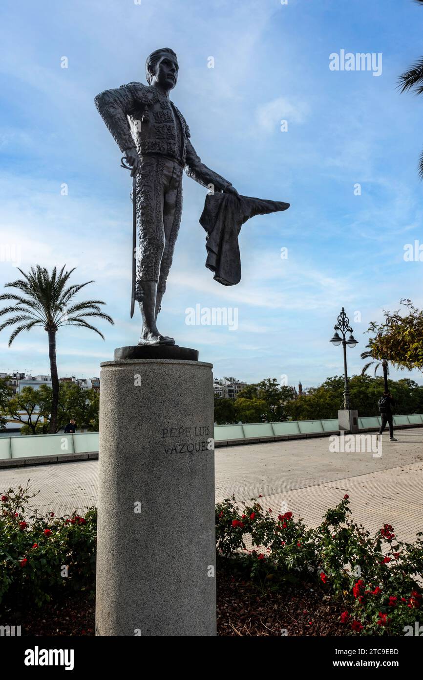 A statue of Pedro Luis Vázquez standing tall against the sky., in Seville, Spain. Stock Photo