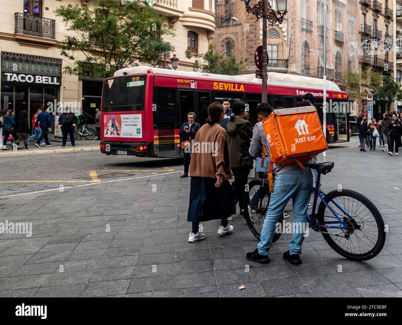 A Just Eat Food delivery rider in Seville, Spain. Stock Photo