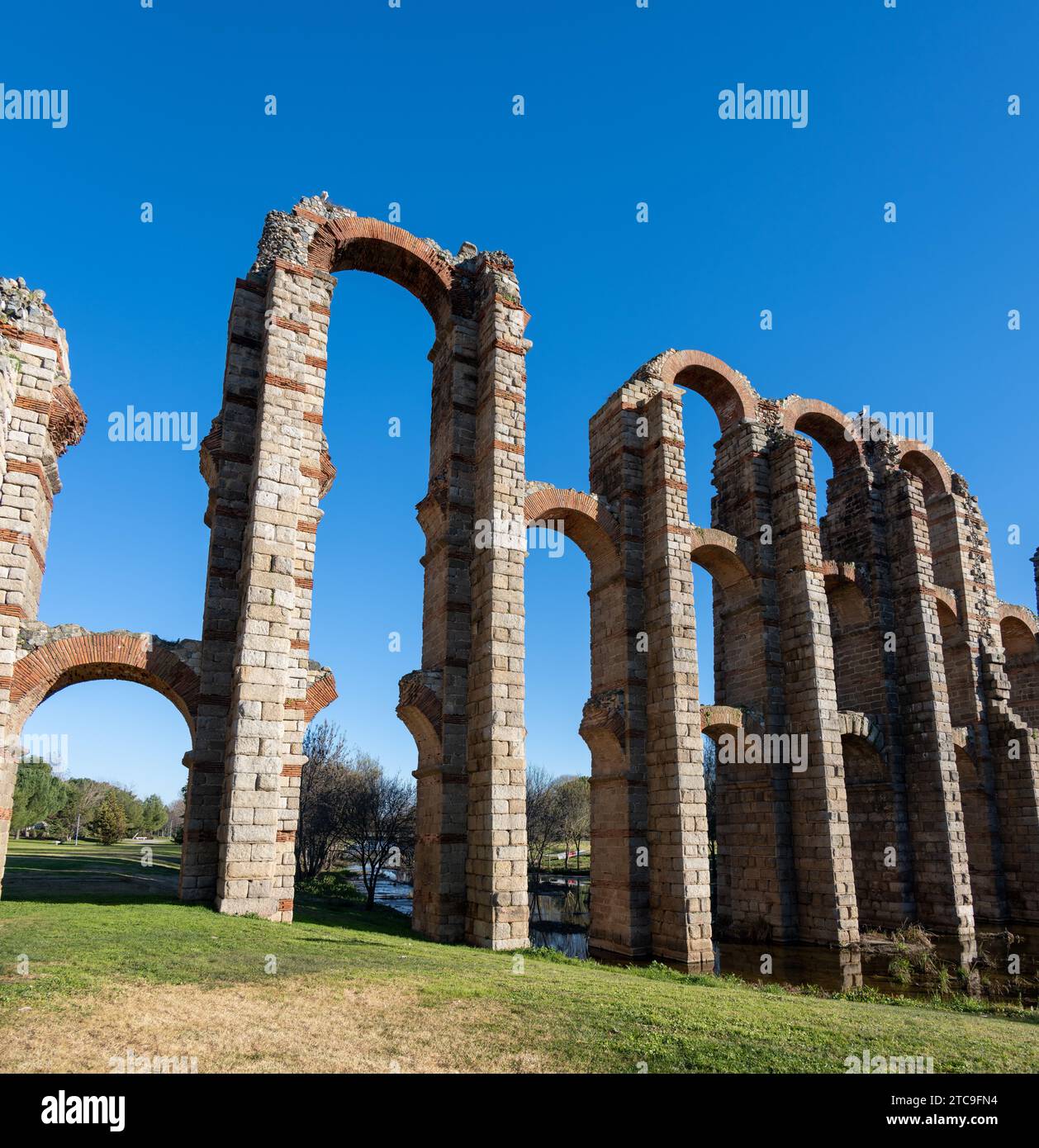 Ancient Roman aqueduct ruins against a clear blue sky Stock Photo - Alamy