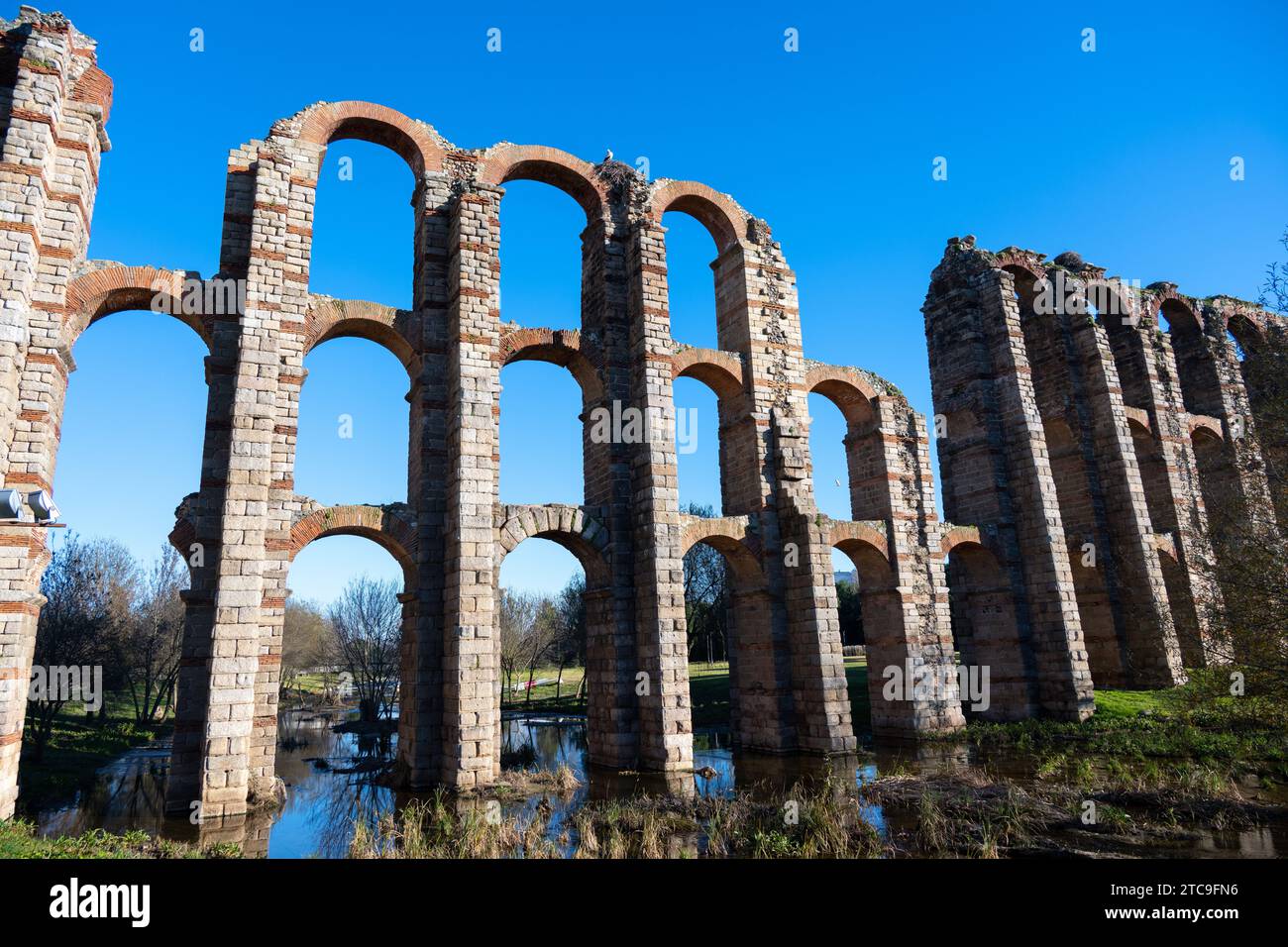 Ancient Roman aqueduct ruins against a clear blue sky Stock Photo - Alamy
