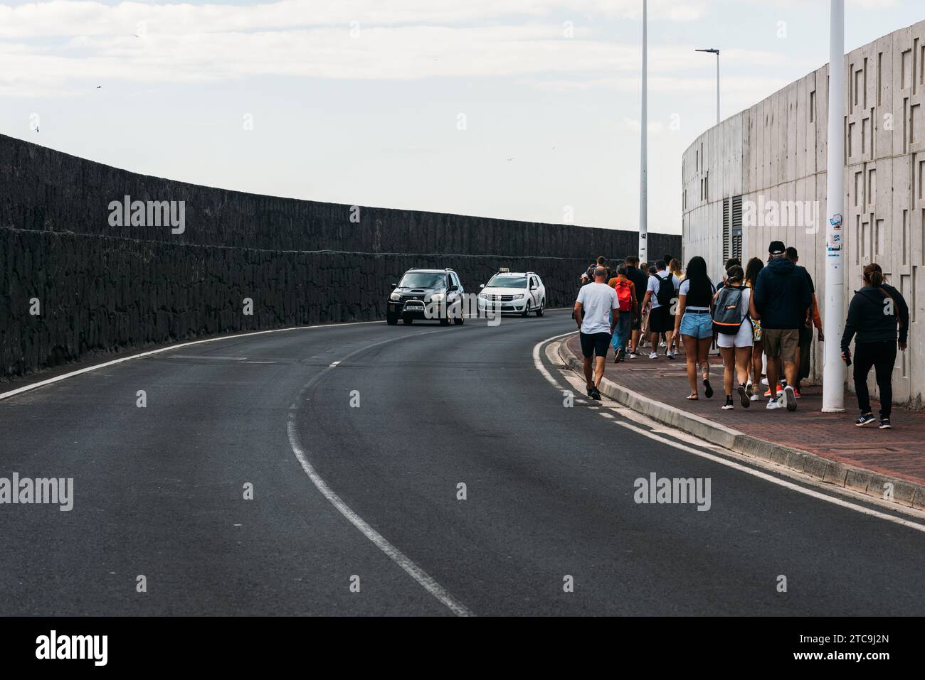 Lanzarote, Spain November 25, 2023 Tourists walking towards the town