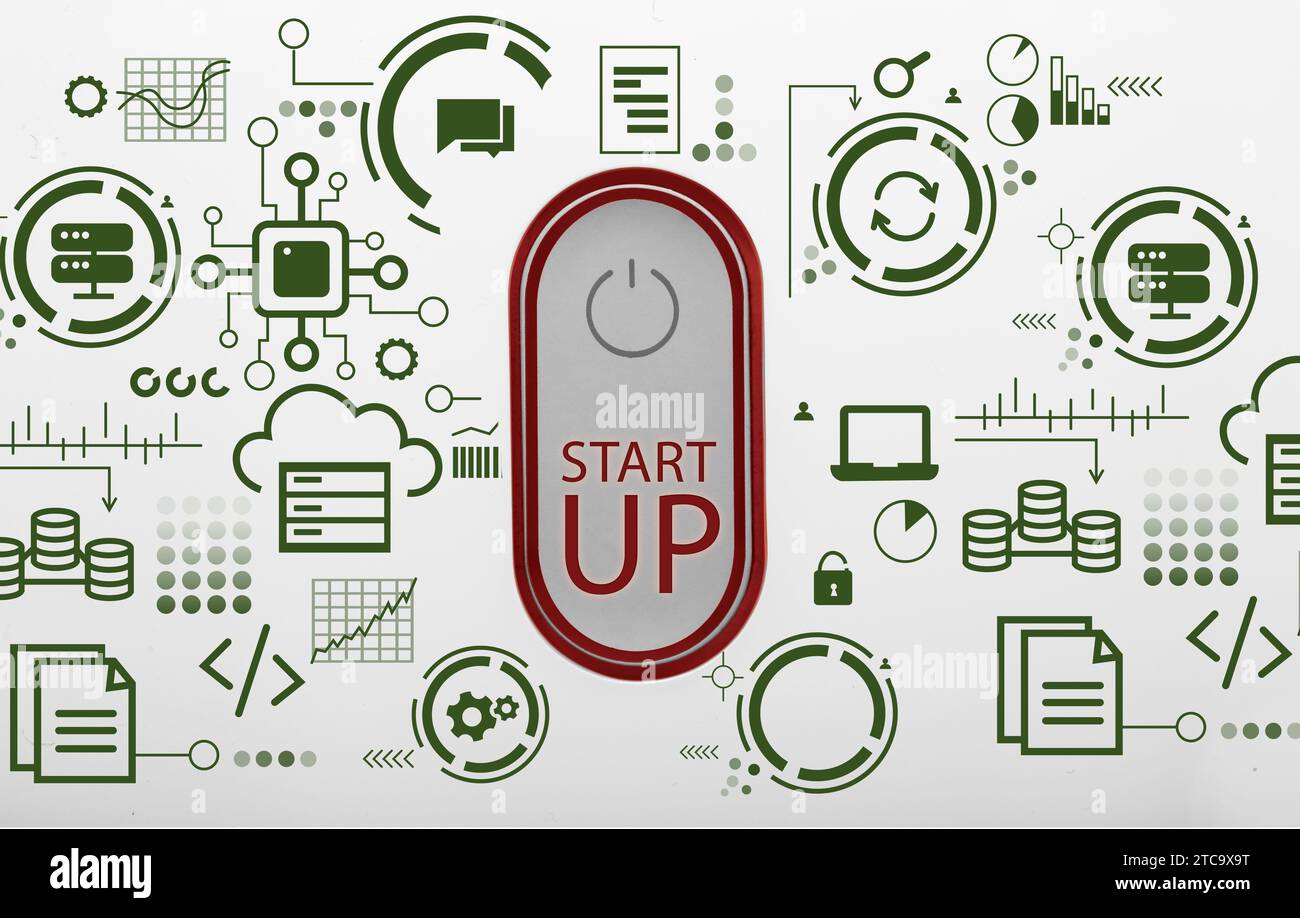 Power button with text START UP and digital icons on light background Stock Photo