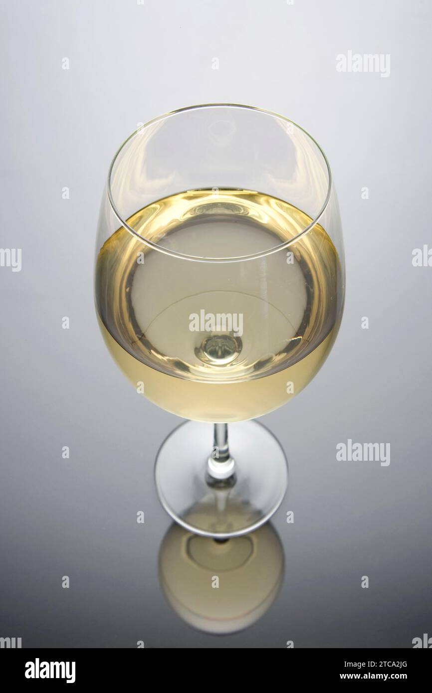 Glass of white wine on a white and black background Stock Photo