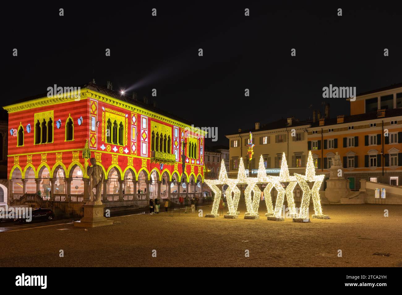 Udine, Italy (8th December 2023) - Piazza della libertà square with Christmas lighting decorations Stock Photo