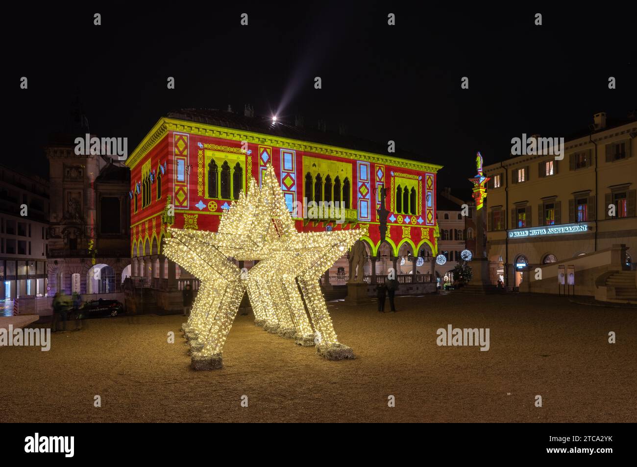 Udine, Italy (8th December 2023) - Piazza della libertà square with Christmas lighting decorations Stock Photo