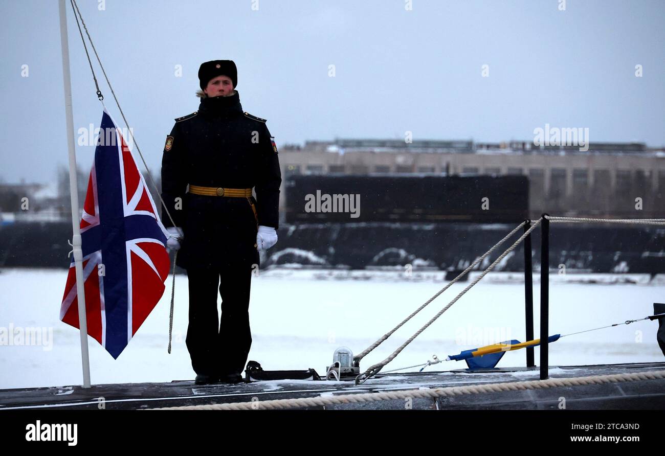 Severodvinsk, Russia. 11th Dec, 2023. Russian navy sailors stand at attention during a flag raising ceremony for the Russian Navy Borei-class nuclear-powered ballistic missile submarine Emperor Alexander III at the Sevmash Shipyard, December 11, 2023 in Severodvinsk, Arkhangelsk region, Russia. Credit: Mikhael Klimentyev/Kremlin Pool/Alamy Live News Stock Photo