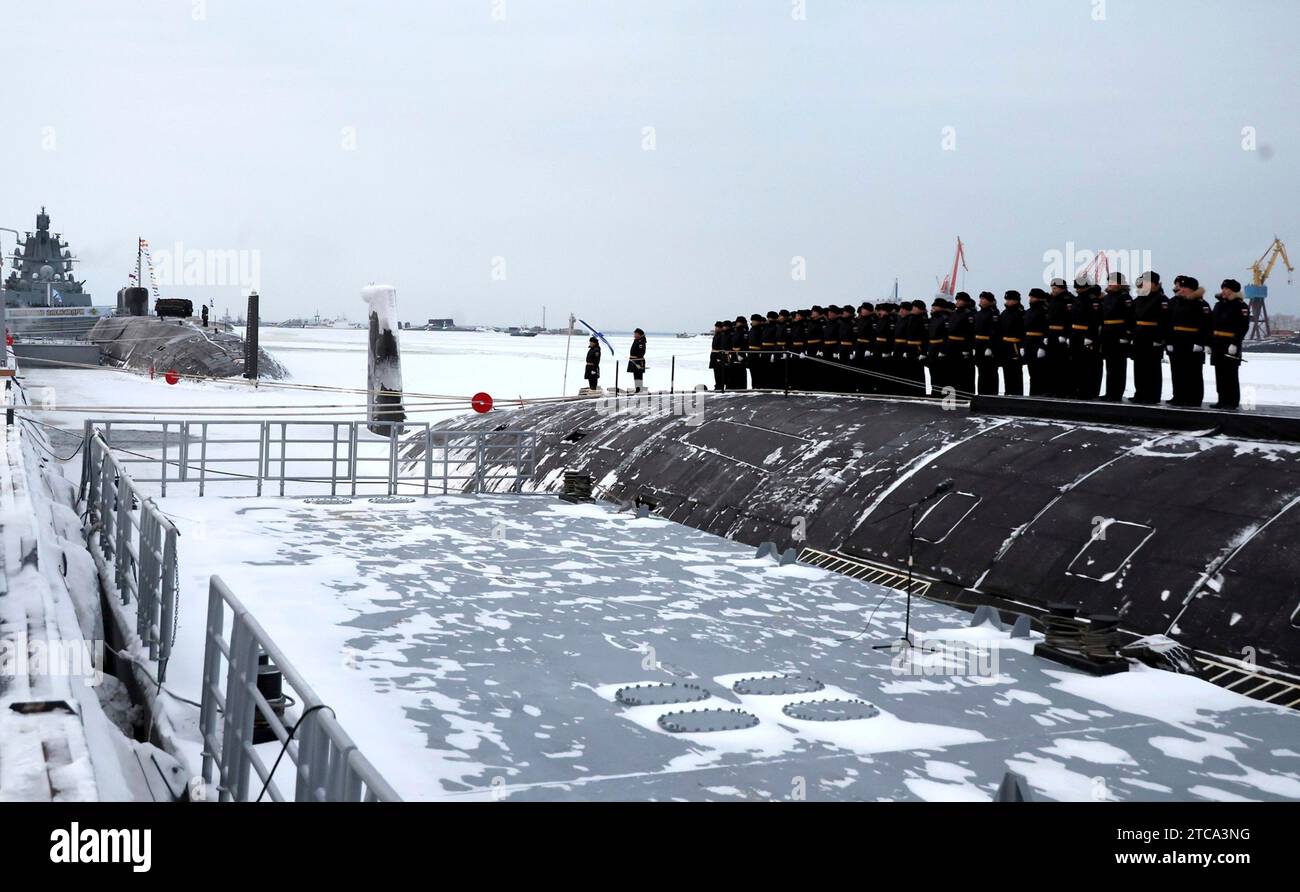 Severodvinsk, Russia. 11th Dec, 2023. Russian navy sailors stand at attention during a flag raising ceremony for the Russian Navy Borei-class nuclear-powered ballistic missile submarine Krasnoyarsk at the Sevmash Shipyard, December 11, 2023 in Severodvinsk, Arkhangelsk region, Russia. Credit: Mikhael Klimentyev/Kremlin Pool/Alamy Live News Stock Photo