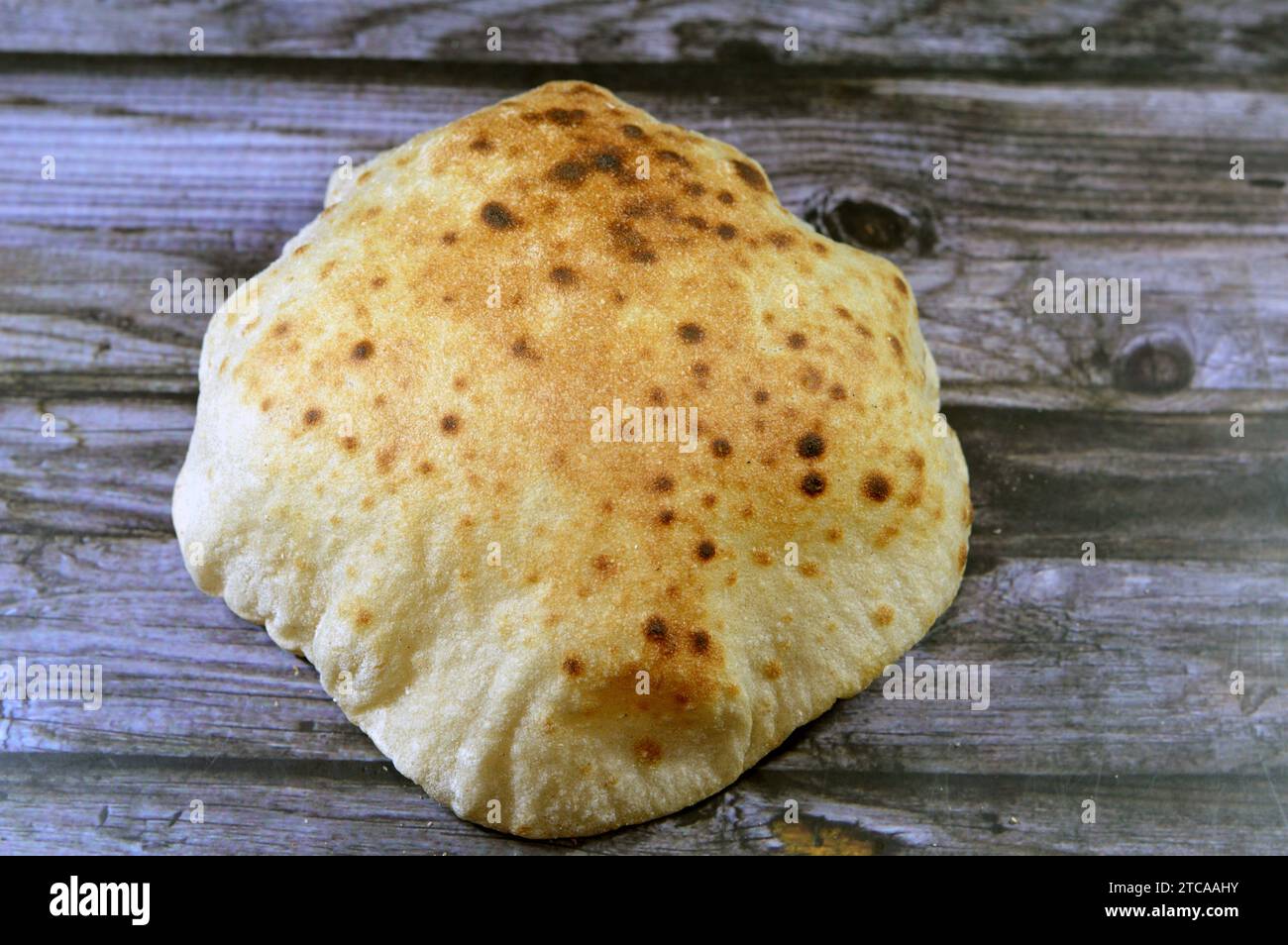 Traditional Egyptian flat bread with wheat bran and flour, regular Aish Baladi or Egypt bread