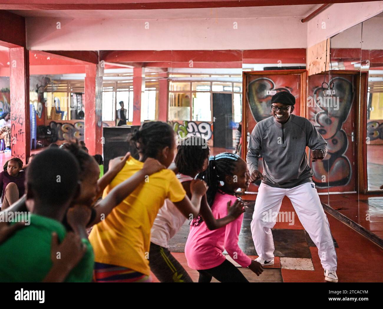 Nairobi, Kenya. 18th Nov, 2023. Mathias Kavita instructs students to dance at Sarakasi dome in Nairobi, Kenya, on Nov. 18, 2023. Mathias Kavita, 52, was among 24 youngsters who in 1983 secured a scholarship domiciled in the China-Kenya cooperation agreement to study acrobatics in China at the tender age of nearly 12, paving the way for a bright future ahead. TO GO WITH 'Feature: Chinese-trained Kenyan acrobatics coach passing life-long skills to local youth' Credit: Han Xu/Xinhua/Alamy Live News Stock Photo