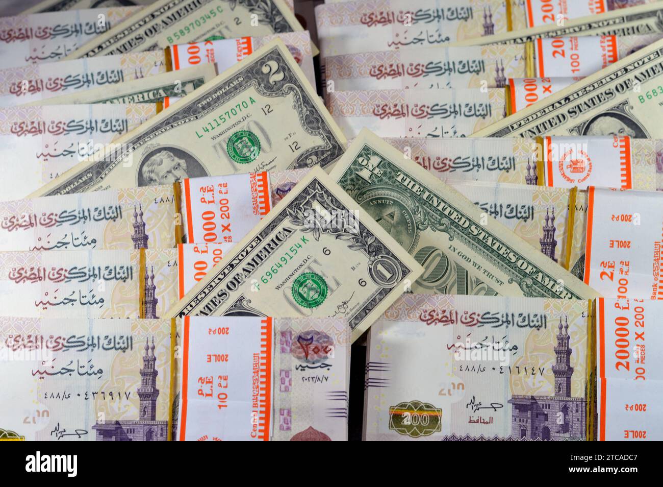 piles-and-stacks-of-egypt-money-thousands-of-pounds-currency-banknotes-bills-of-200-egp-le-egyptian-money-exchange-rate-and-usa-american-dollars-ban-2TCADC7.jpg