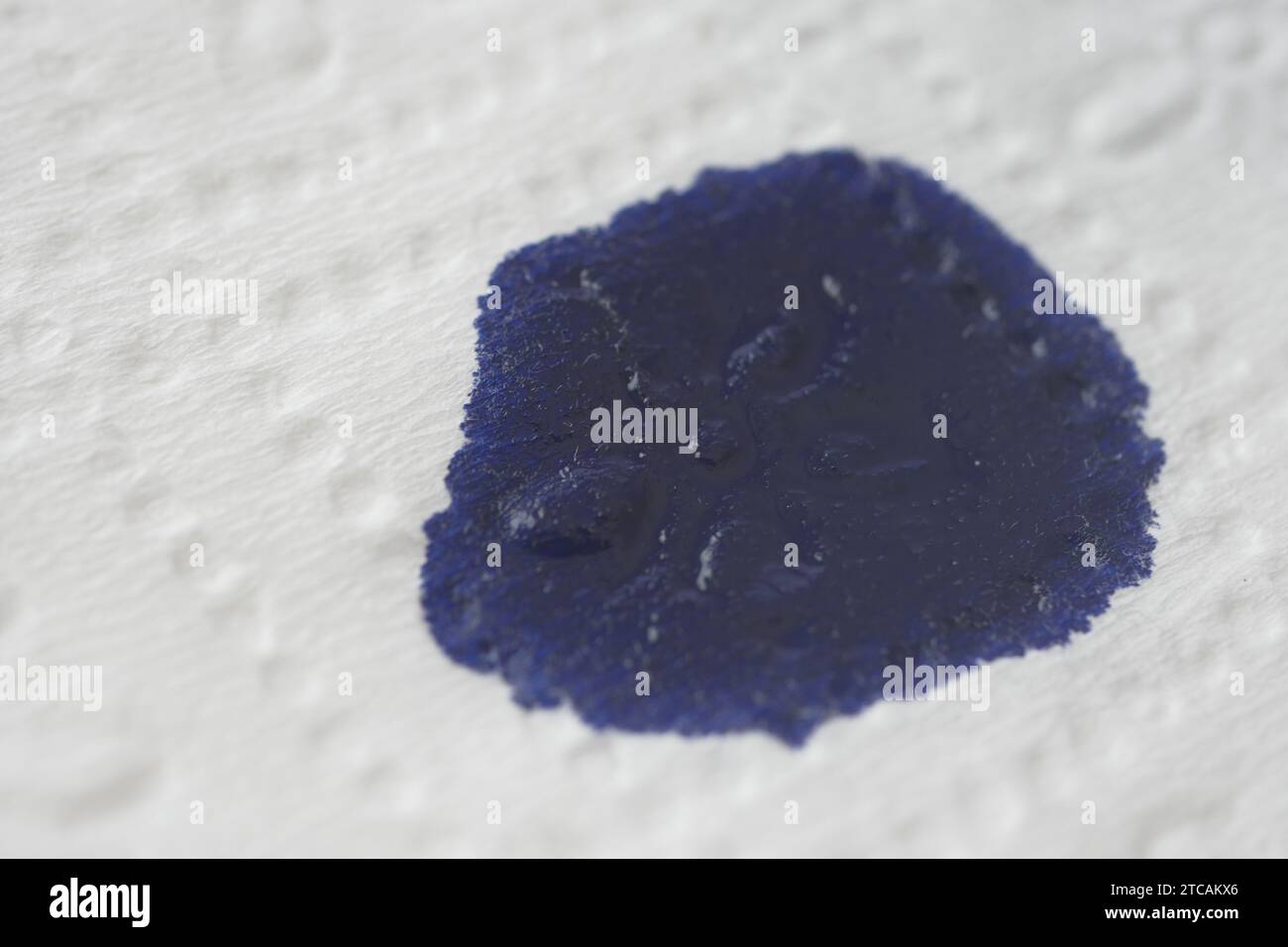 white paper with blue ink stain Stock Photo - Alamy