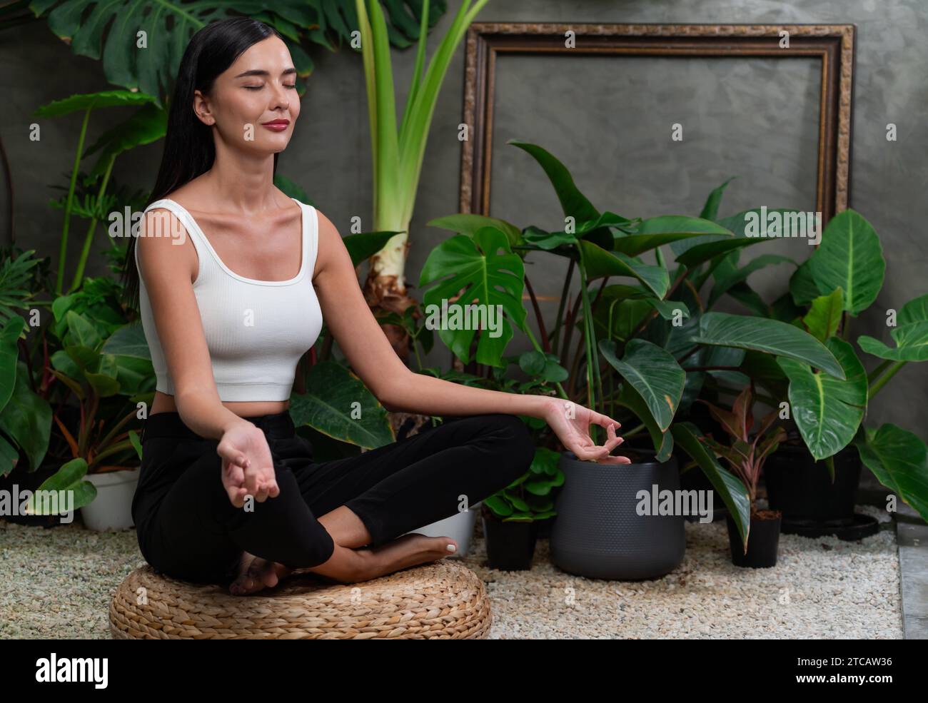 Female Doing Yoga Poses On Sunny Morning In The Green Garden Stock