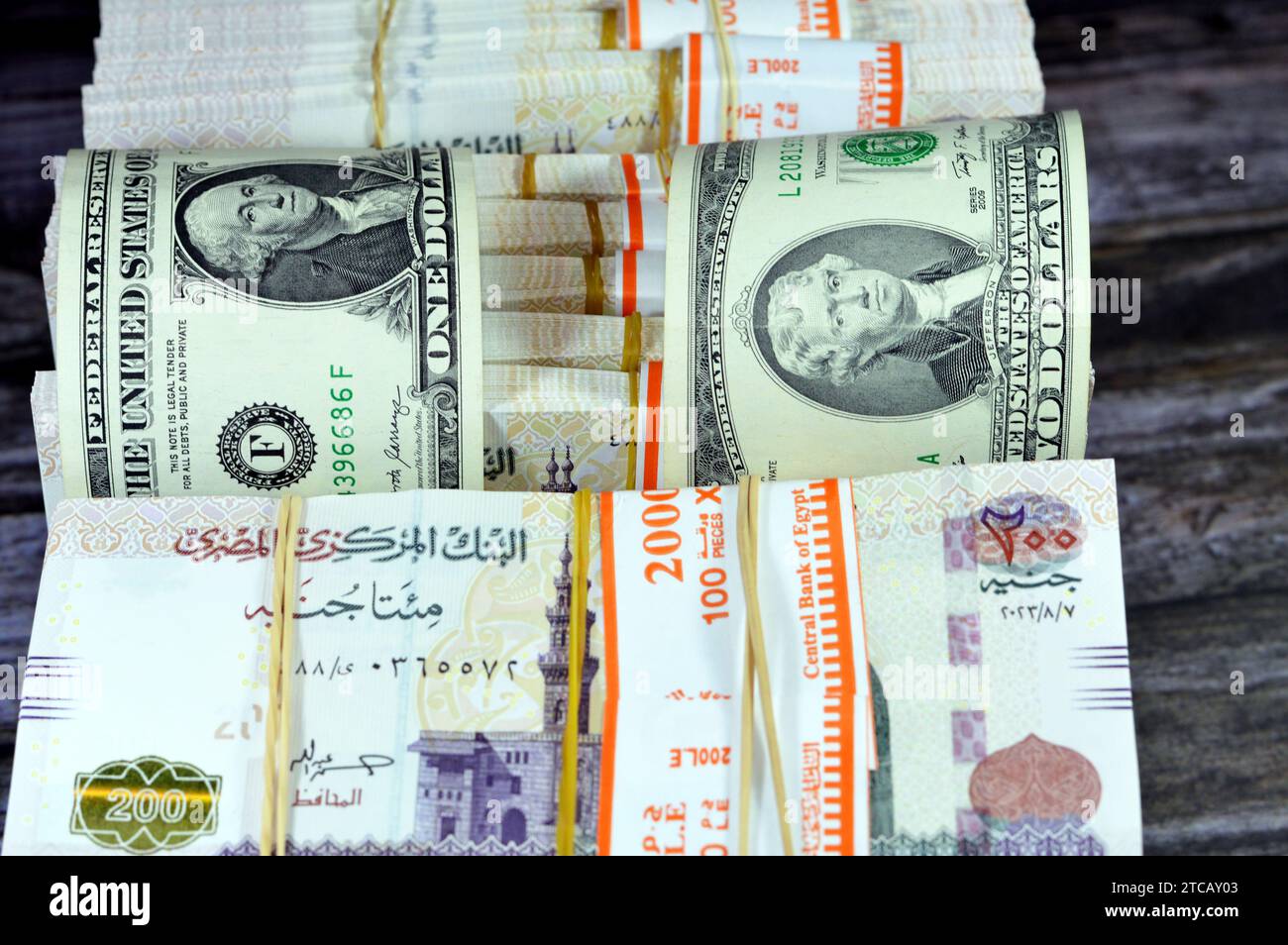 piles-and-stacks-of-egypt-money-thousands-of-pounds-currency-banknotes-bills-of-200-egp-le-egyptian-money-exchange-rate-and-usa-american-dollars-ban-2TCAY03.jpg