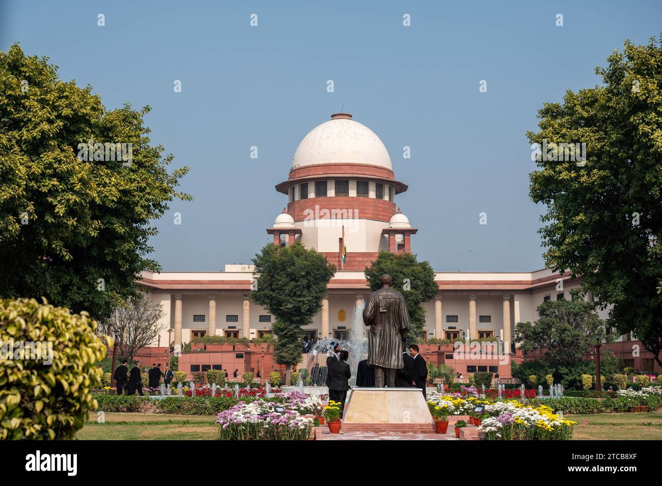 Supreme Court of India during verdict of Article 370, New Delhi, India. Article 370, a temporary provision in the Indian Constitution, granted special autonomy to Jammu and Kashmir after its accession to India in 1947. In August 2019, the BJP government, led by Prime Minister Narendra Modi, revoked Article 370, ending the region's special autonomy. The state was bifurcated into two Union Territories - Jammu & Kashmir and Ladakh. This decision triggered diverse reactions, both nationally and internationally, and underwent legal scrutiny, with the Supreme Court of India playing a pivotal role in Stock Photo