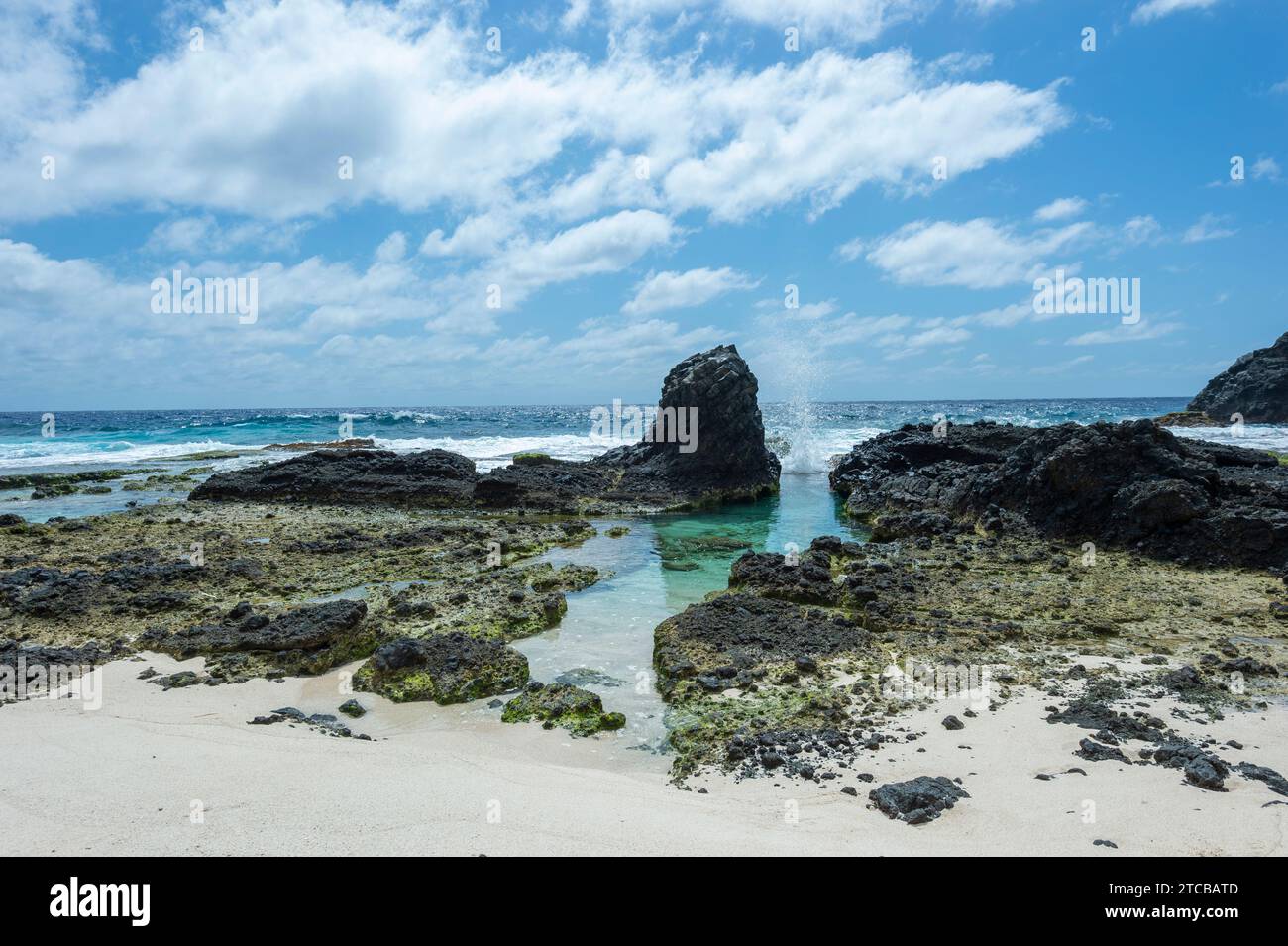 Scenic view of the rugged coastline at Dolly Beach, a popular beach on Christmas Island, Australia Stock Photo