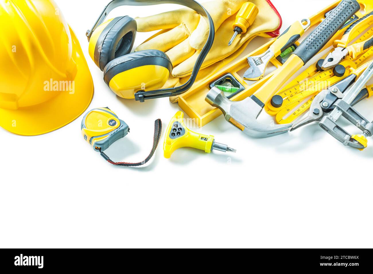 Large set of yellow construction tools against a white background Stock ...