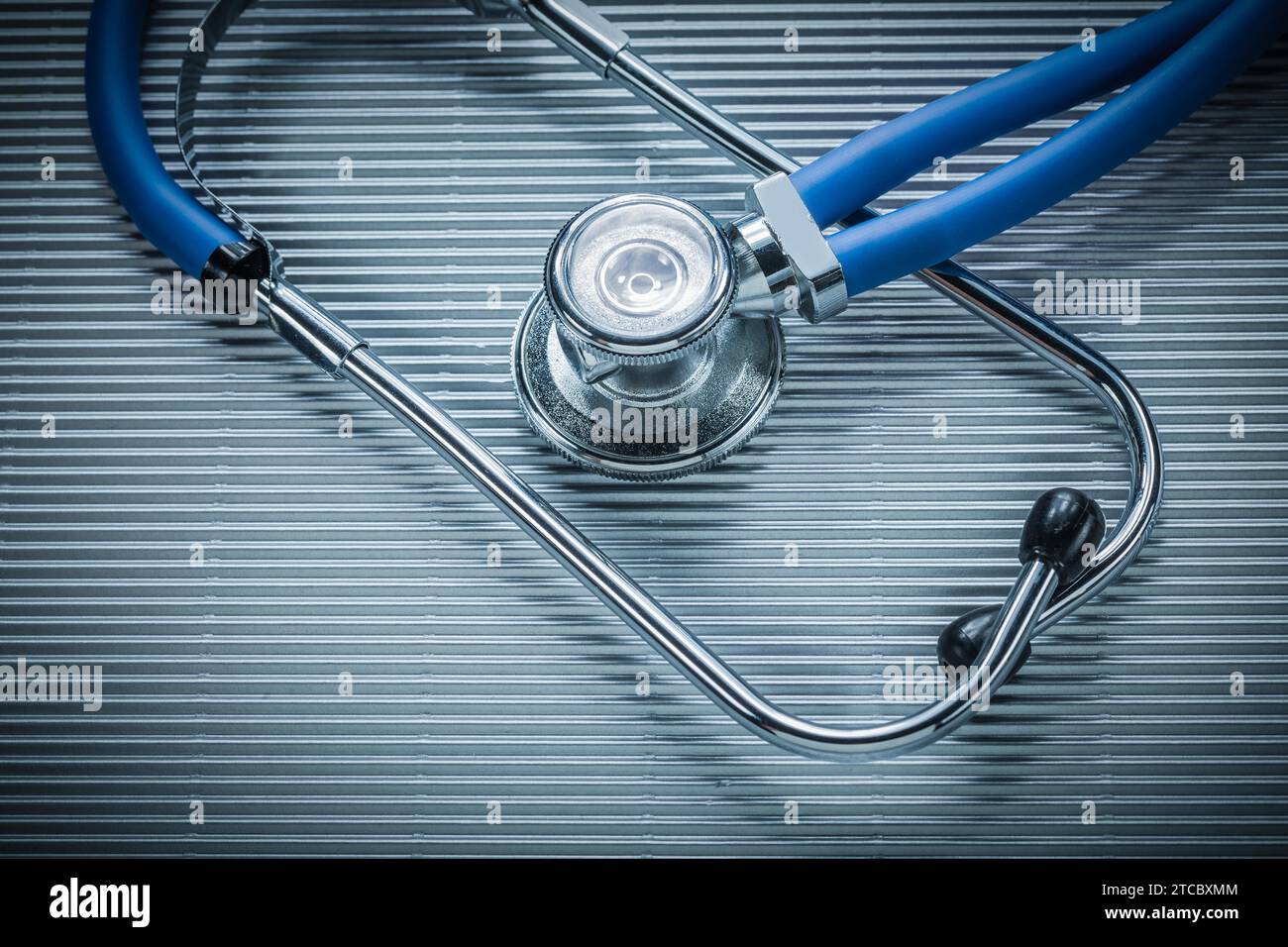 Medical stethoscope on striped background Stock Photo