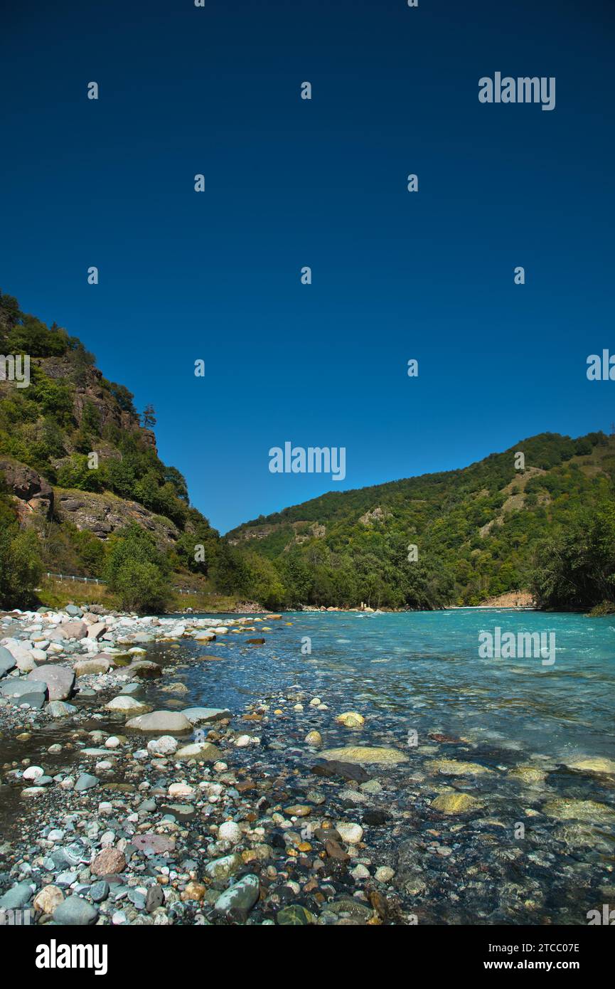 Portable Water From Rever Landscape of a mountain river with drinking water in the Caucasus, fed ...
