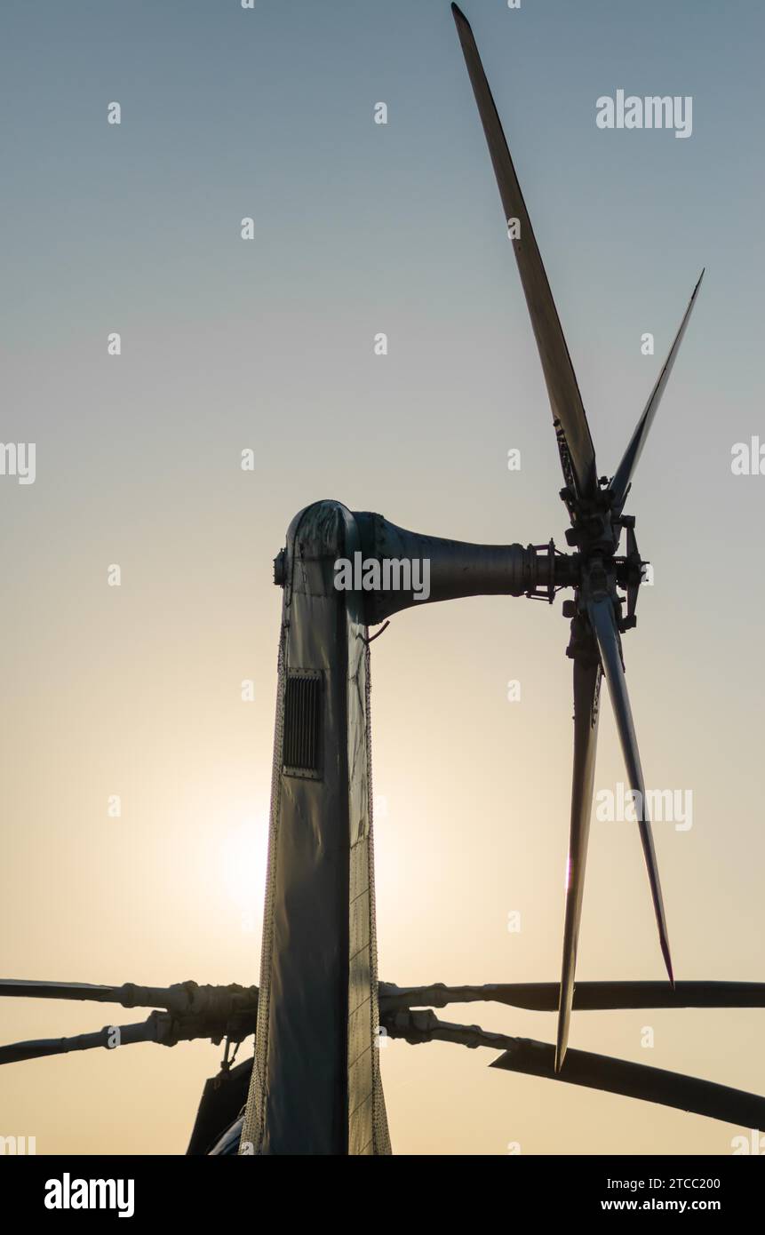 Transport rotor blade background of an old vintage helicopter isolated on a background of the evening sky and sun Stock Photo