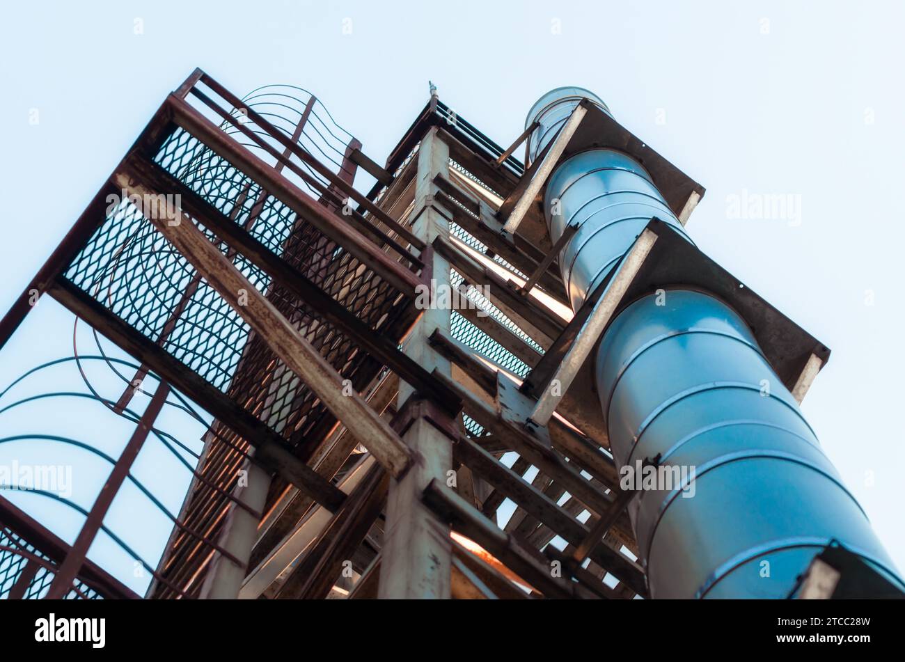 High technical structure with a pipe against the blue sky Stock Photo