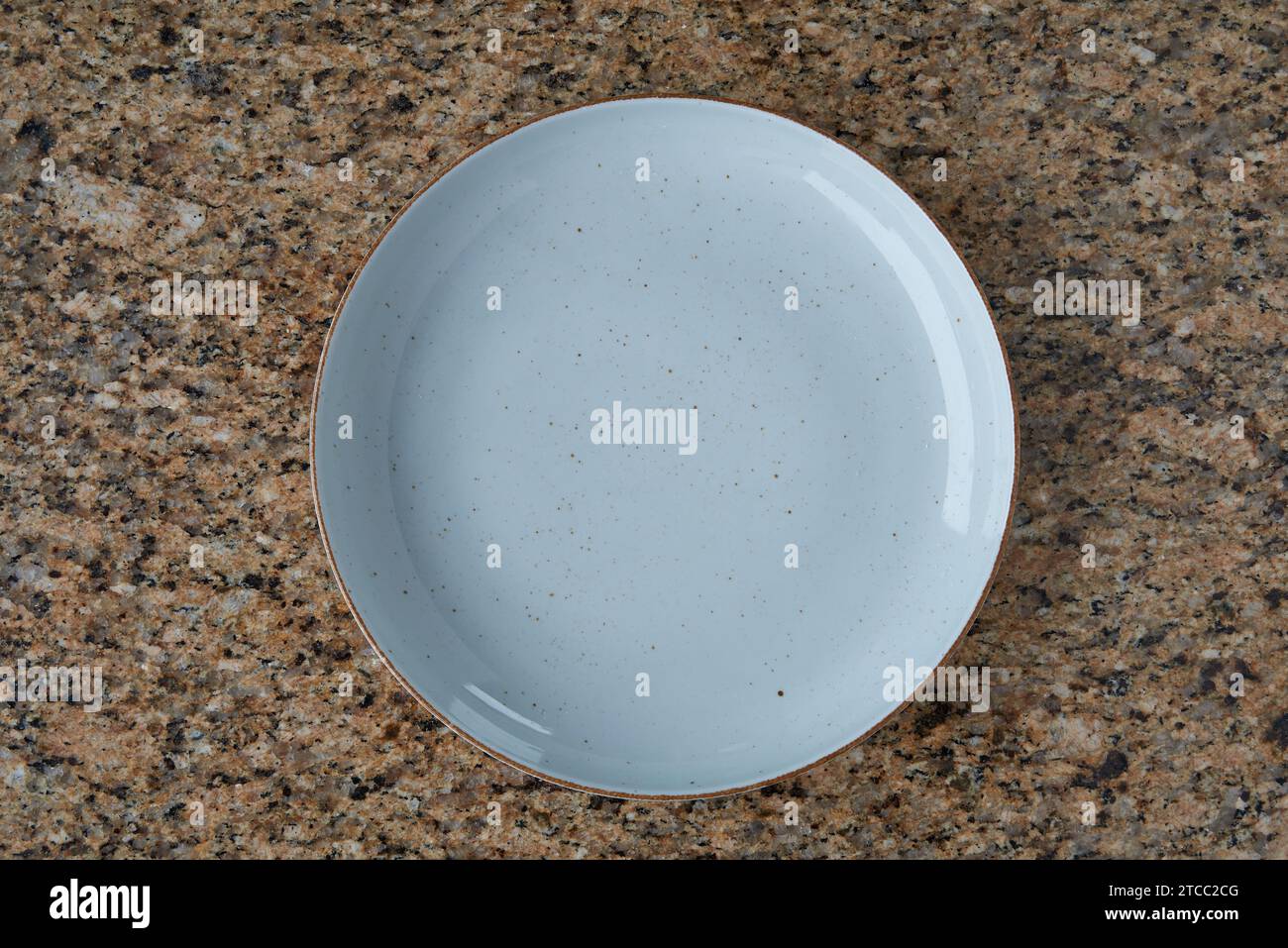 Blue empty plate on Textured marble texture, view from above Stock Photo