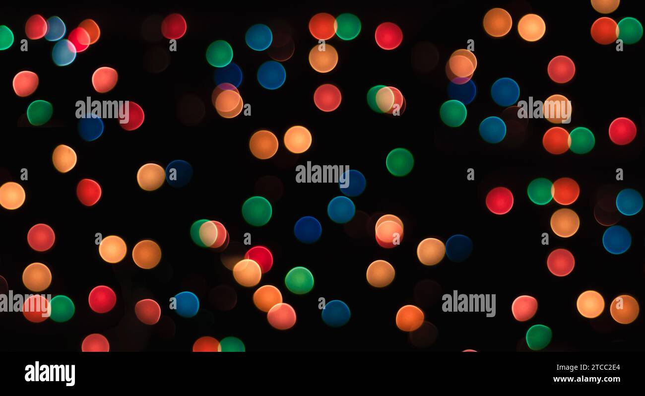 Multicolored circles on a black background with blur abstract pattern Stock Photo