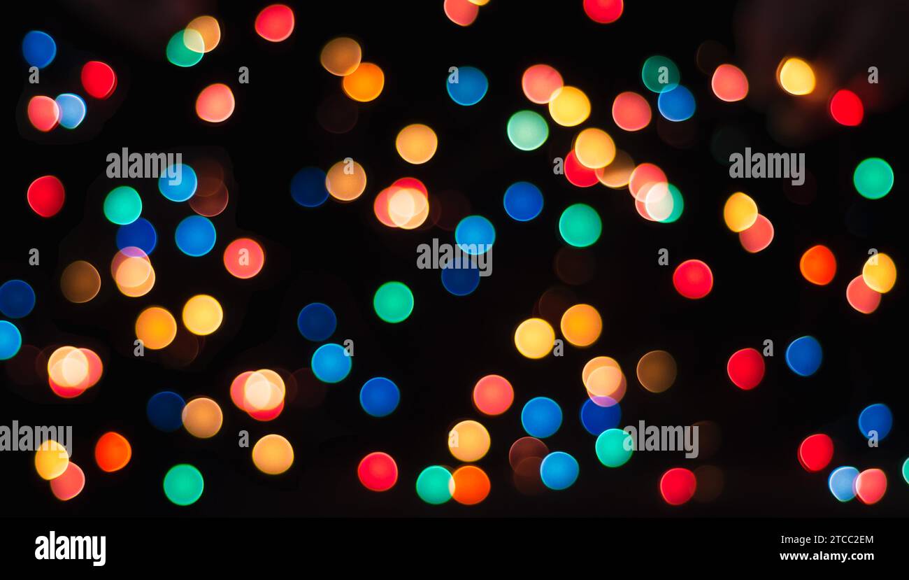 Multicolored circles on a black background with blur abstract pattern Stock Photo