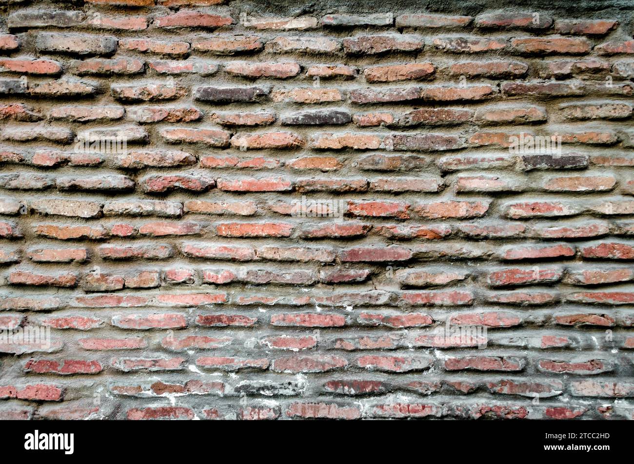 Pattern texture of old vintage orange brick wall detailed background Stock Photo