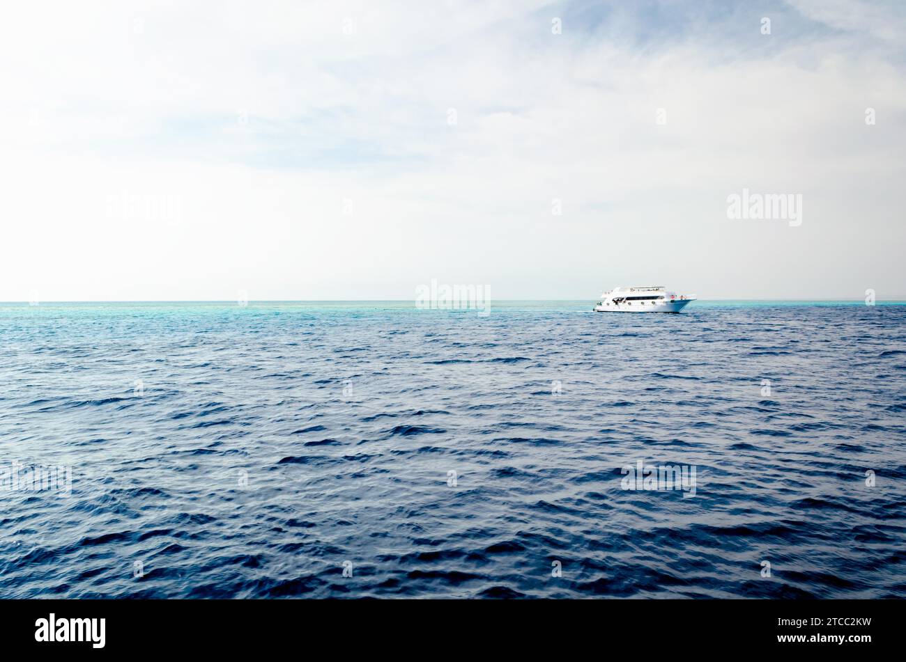White cruise tourist boat on the background of the coast in the Red Sea ...