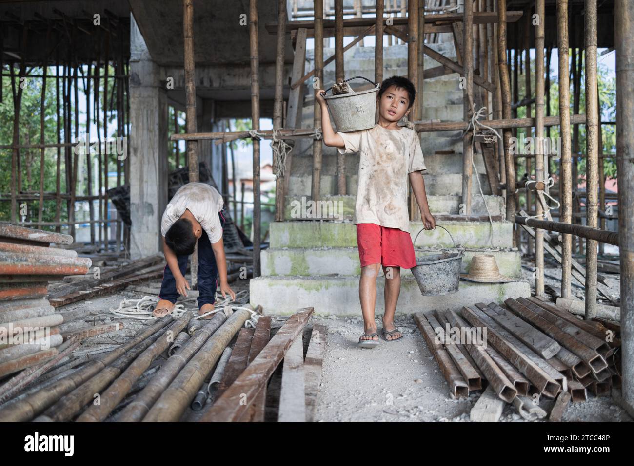 Poor Laborer Concept of child labor, poor children being victims of construction ...