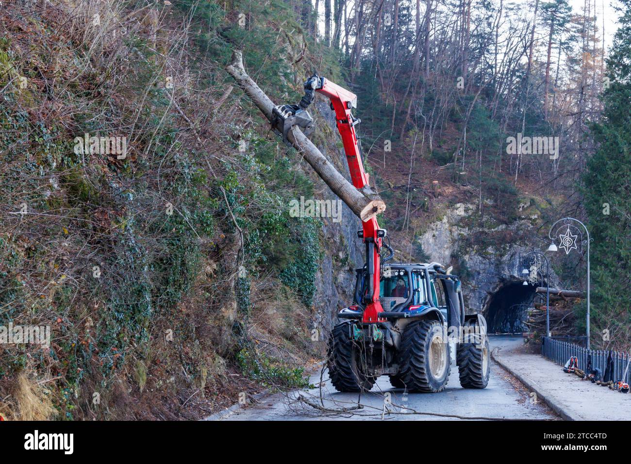 Forest harvester crane working on a road Bled, Slovenia, 7 December 2023 Stock Photo