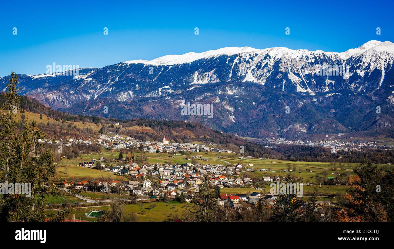 Panoramic of the town of Zasip in Slovenia with the Julian Alps with snow in the background  Zasip, Slovenia, December 7 , 2023 Stock Photo