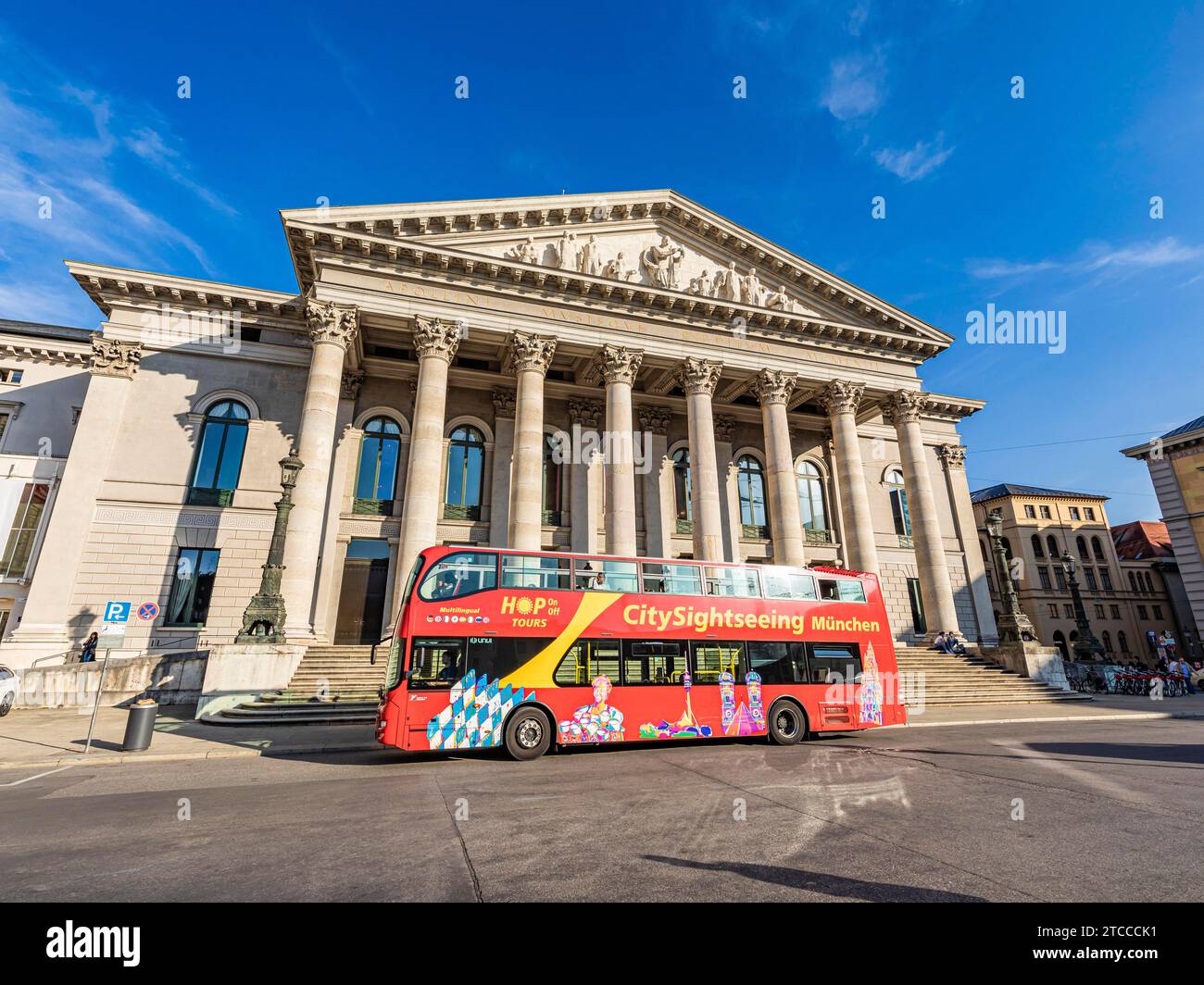 Bus for city tour in front of the National Theatre at Max-Joseph-Platz, Bavarian State Opera, Munich, Bavaria, Germany Stock Photo